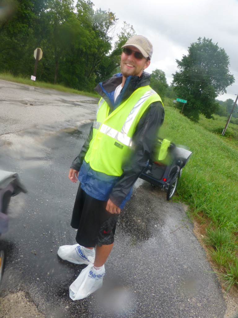 Mike trying to stay dry (with bags on his feet)